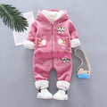 Child wearing a long sleeve golden mink fleece pyjama set with cartoon animal pattern in navy blue for winter
