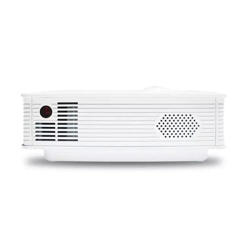 White home projector with LED lens on a table, showing a bright projected image on a wall