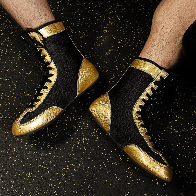 Professional black and gold mesh boxing shoes with non-slip soles for indoor training.