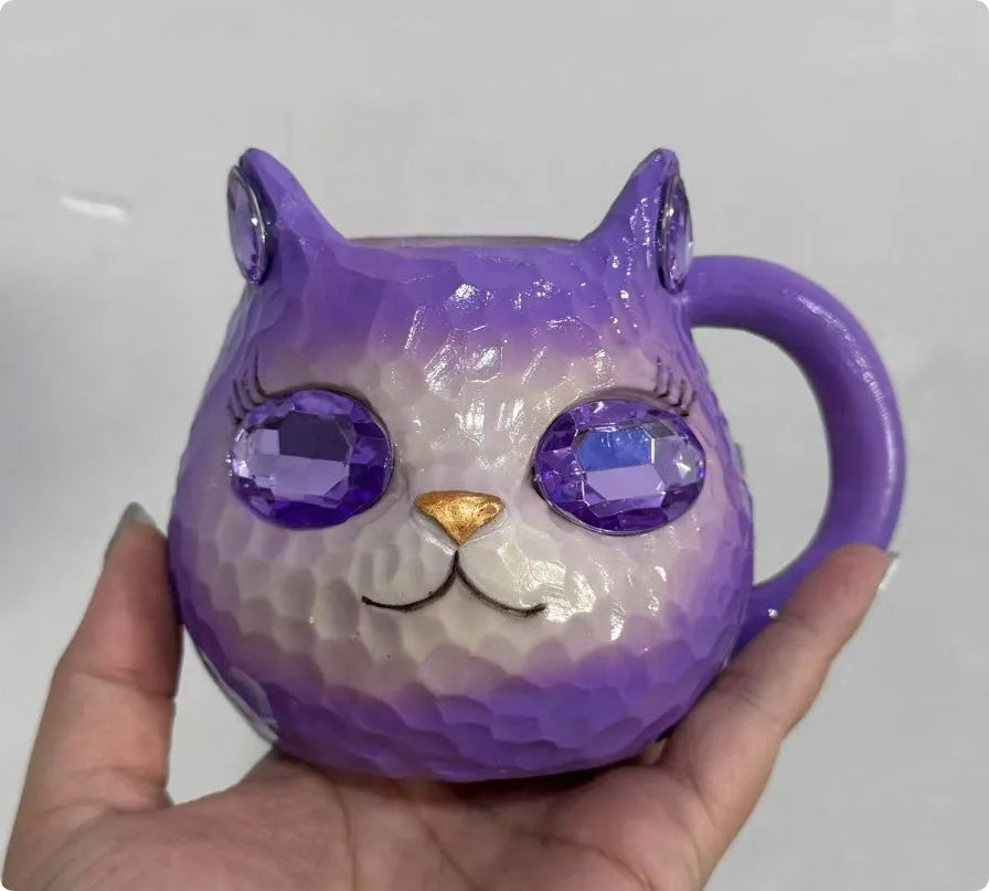 Crystal Earth globe decorative ornament on top of a colourful cat-shaped resin cup.