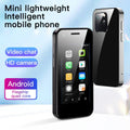 Small black Android phone showing home screen on 2.5-inch display next to protective case
