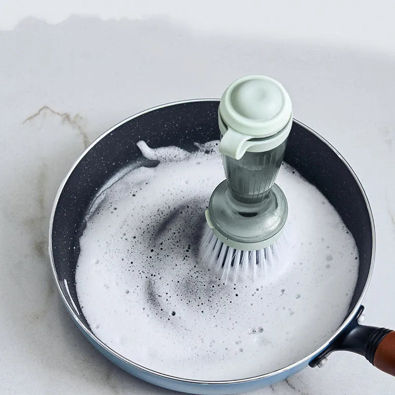 Milk white and mint green pot brush with integrated soap dispenser and replaceable head.