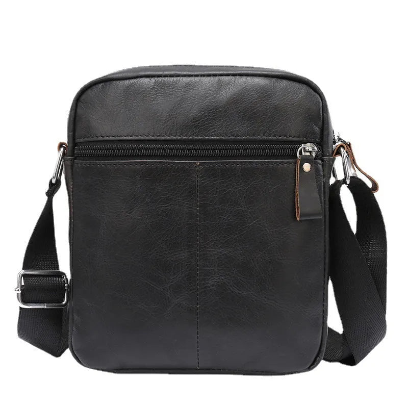 Black and brown 8-inch genuine cowhide leather crossbody messenger bag for boys with retro style.
