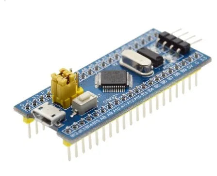 STM32F103C8T6 ARM STM32 minimum system development board module showing microcontroller chip, USB port, and pin headers.
