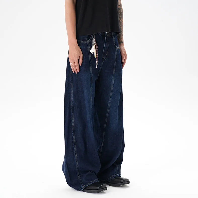Dark blue wide leg women's jeans with a machete cut and distressed detailing on denim fabric.