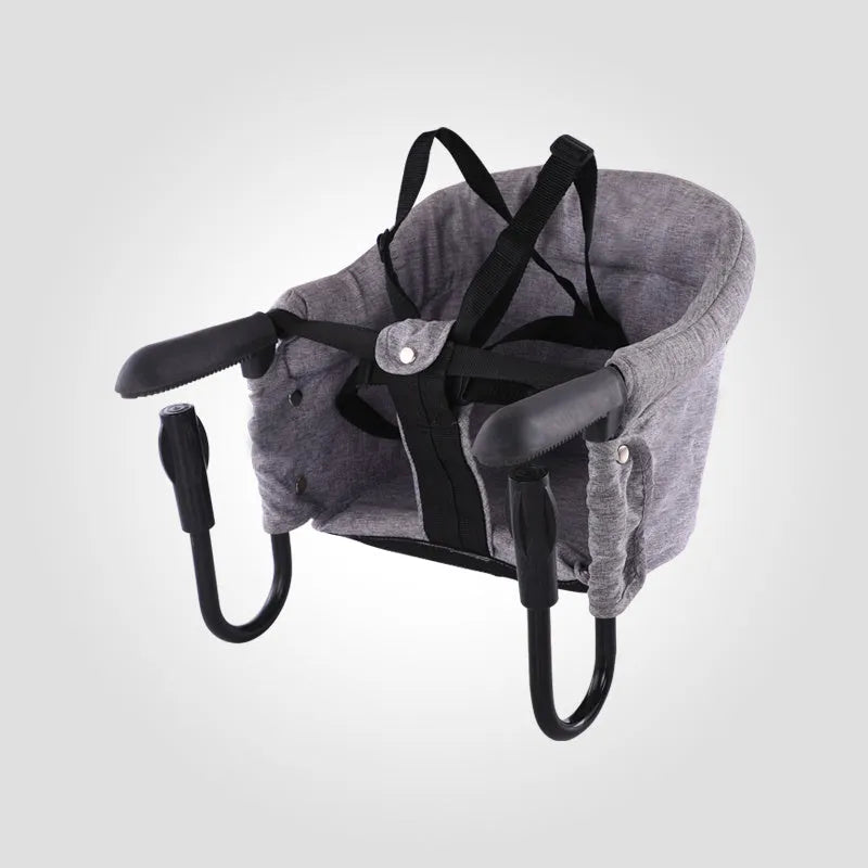 Portable baby dining cover seat with safety belt on a dining chair