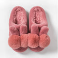 Women's rabbit fur winter slippers with high upper, floral detail, and sewn sole in creamy white.