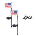 Solar garden flag light with stainless steel stake showing American flag design illuminated by white LEDs