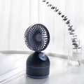 Mini USB fan humidifier in white, side view showing fan blades and mist nozzle