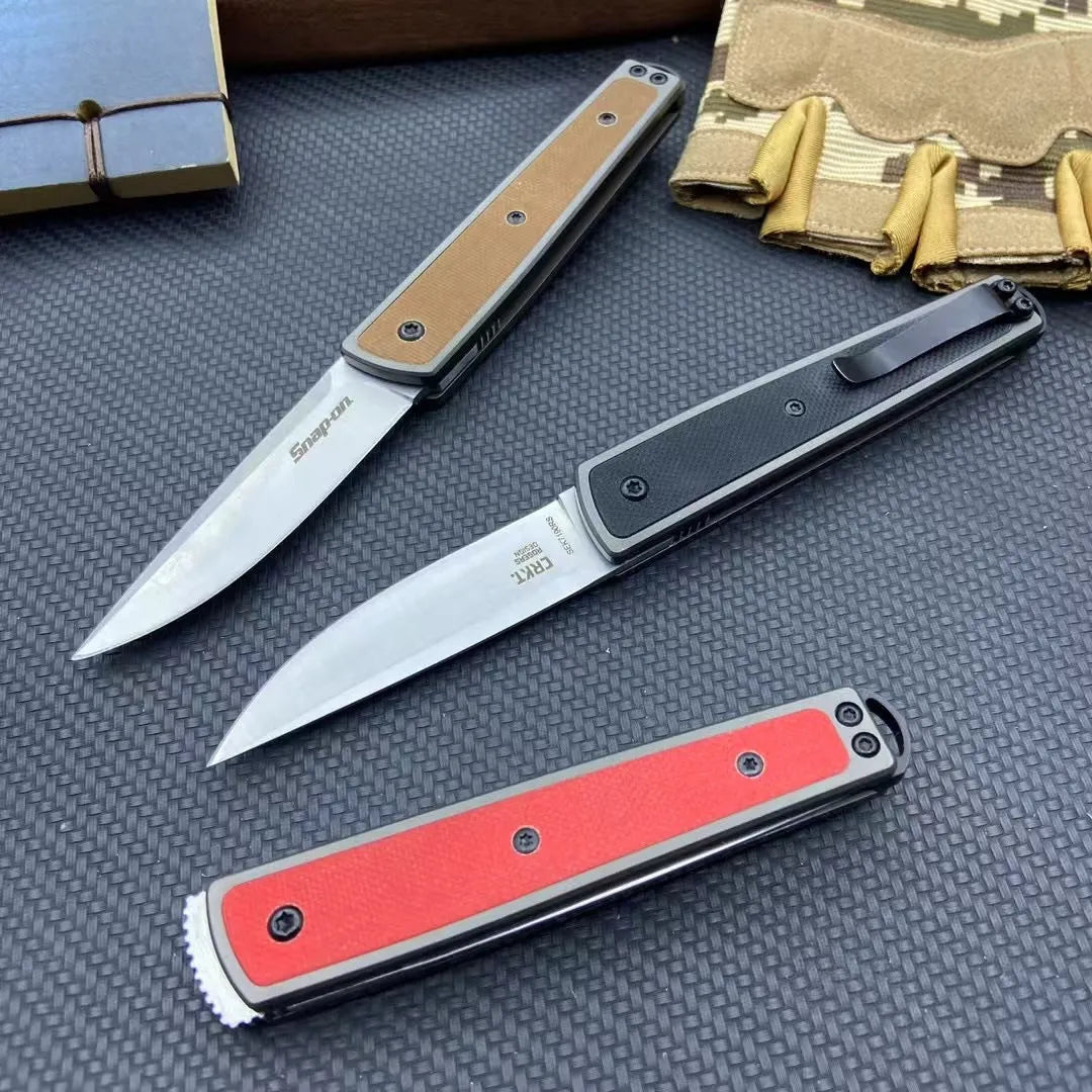 CRKT 7190 folding fruit knife with stainless steel blade shown closed and open, in black, brown, or red colour options.
