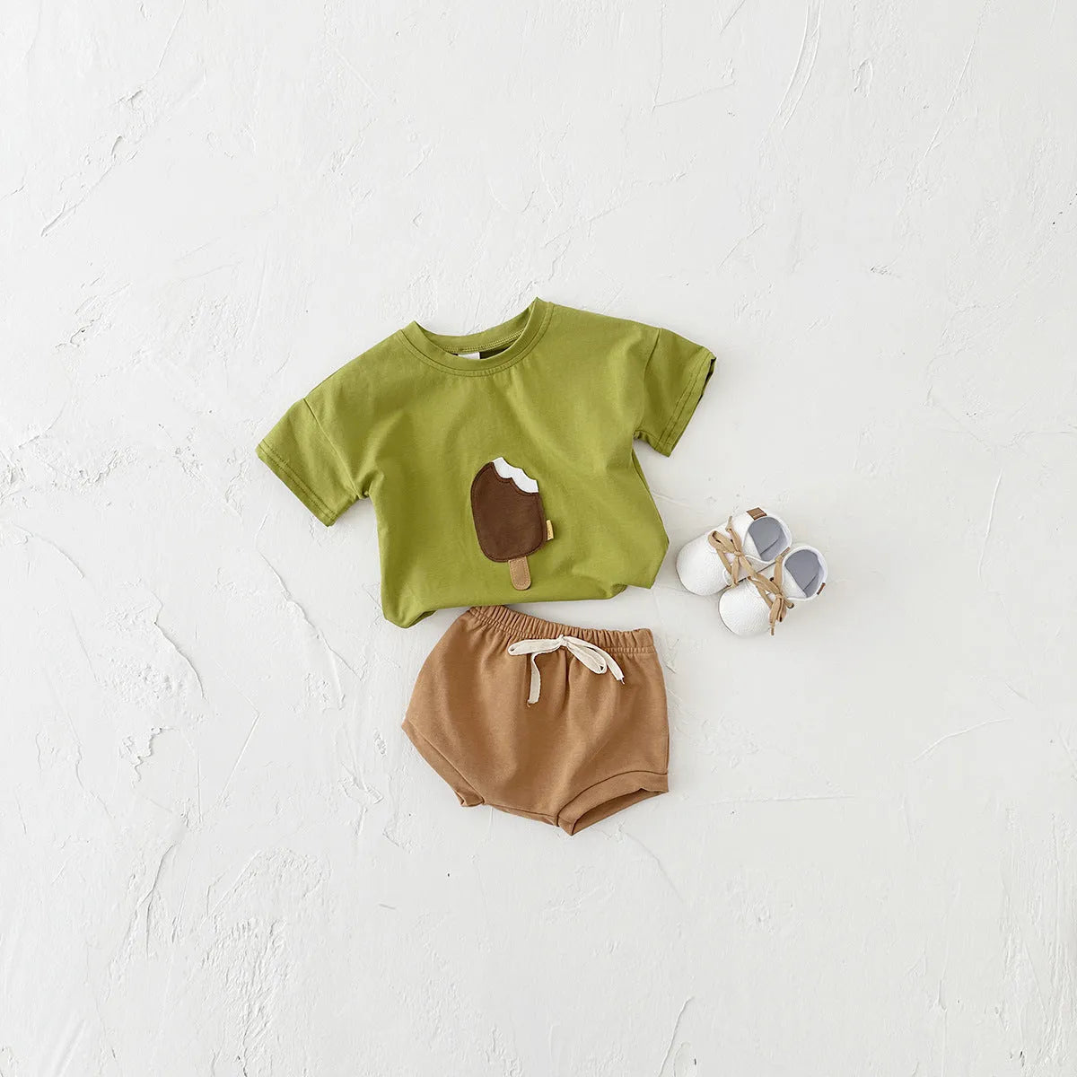 Girls' apricot coloured cotton shorts suit set with ice cream patch, short sleeves and round neck.