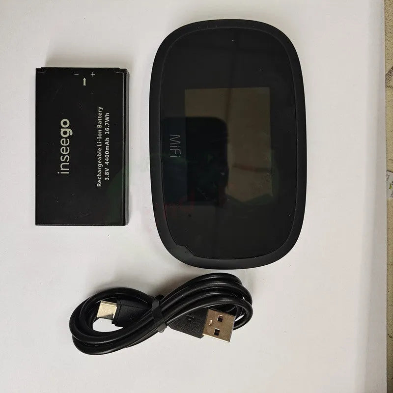 Black mifi8000 4G portable wireless router showing its compact size next to a data cable.