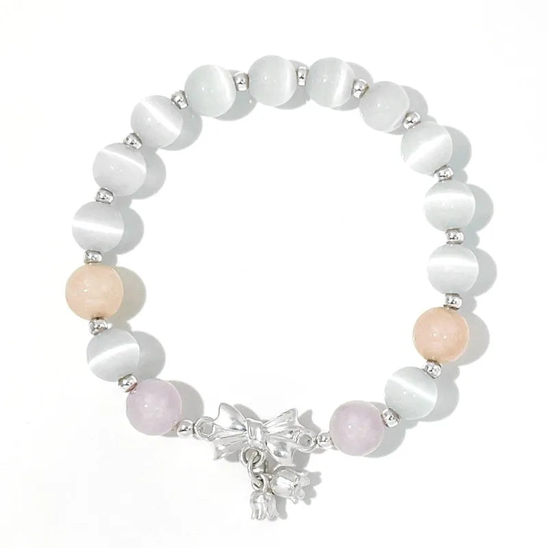 Lavender purple bowknot opal crystal bracelet with electroplated finish for women.