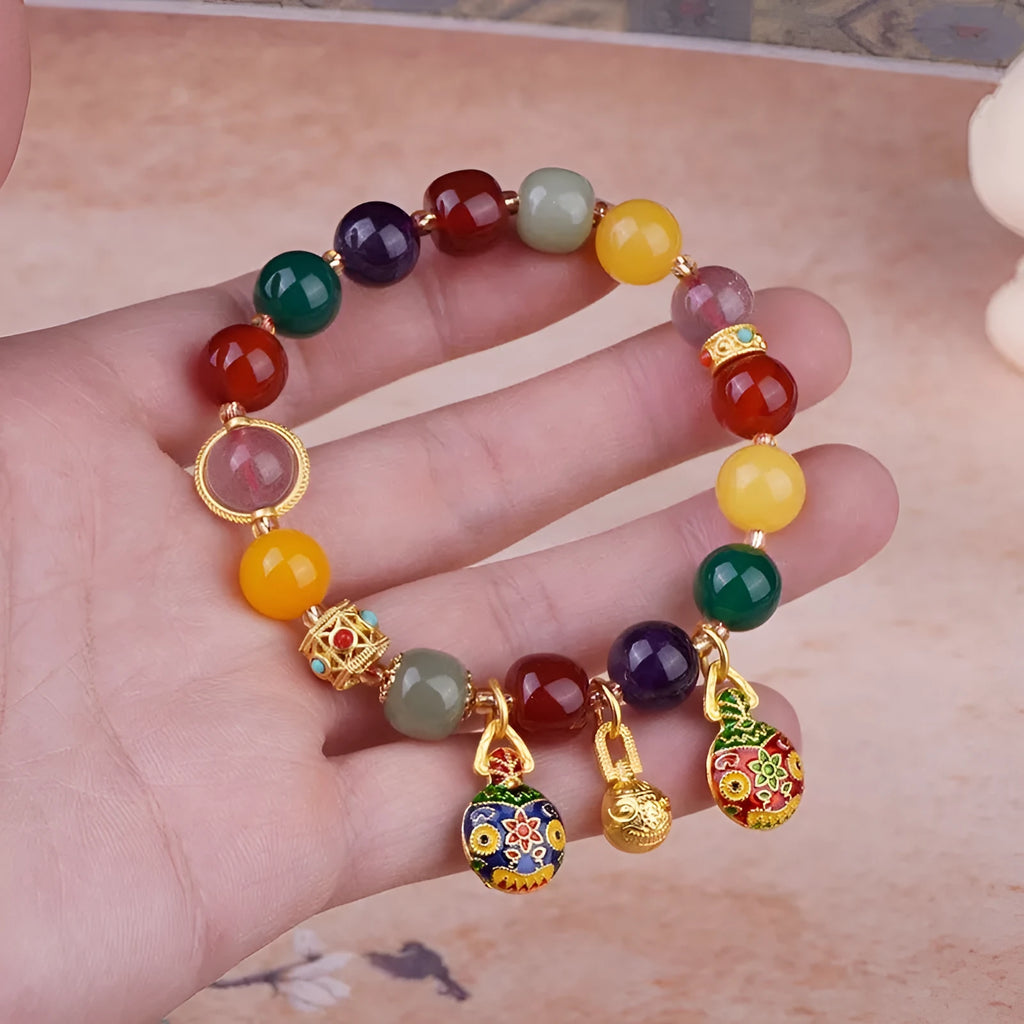 Hand-woven swallowing gold beast charm on 10mm agate bead bracelet