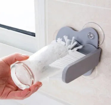 Grey double-head rotating cup brush with suction cups for wall mounting, length 17.5cm.