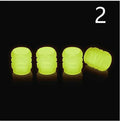 Luminous rubber tyre valve caps showing split design and available glow colours