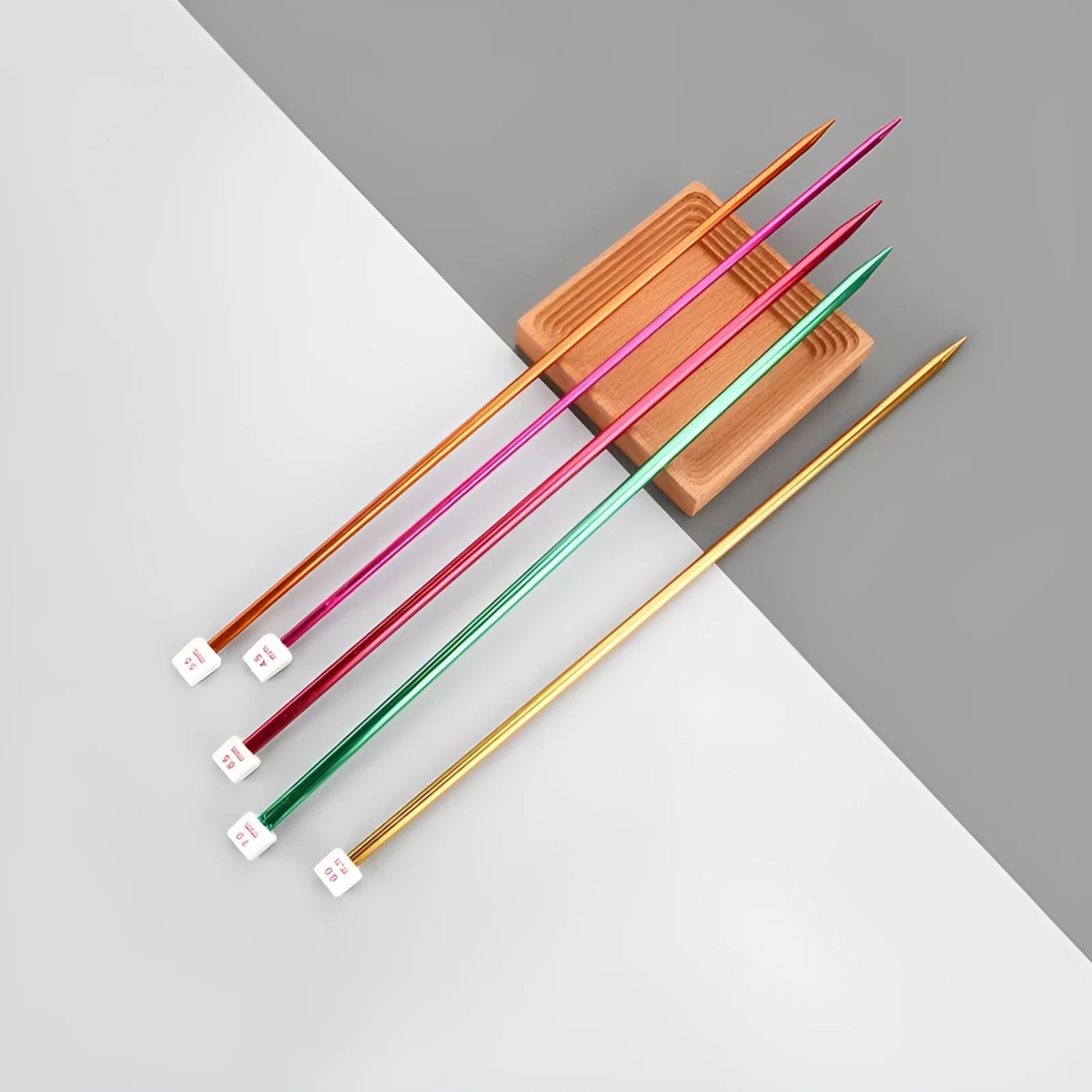Set of lengthened crochet hooks with protective end caps in multiple sizes from 2.0mm to 10.0mm.