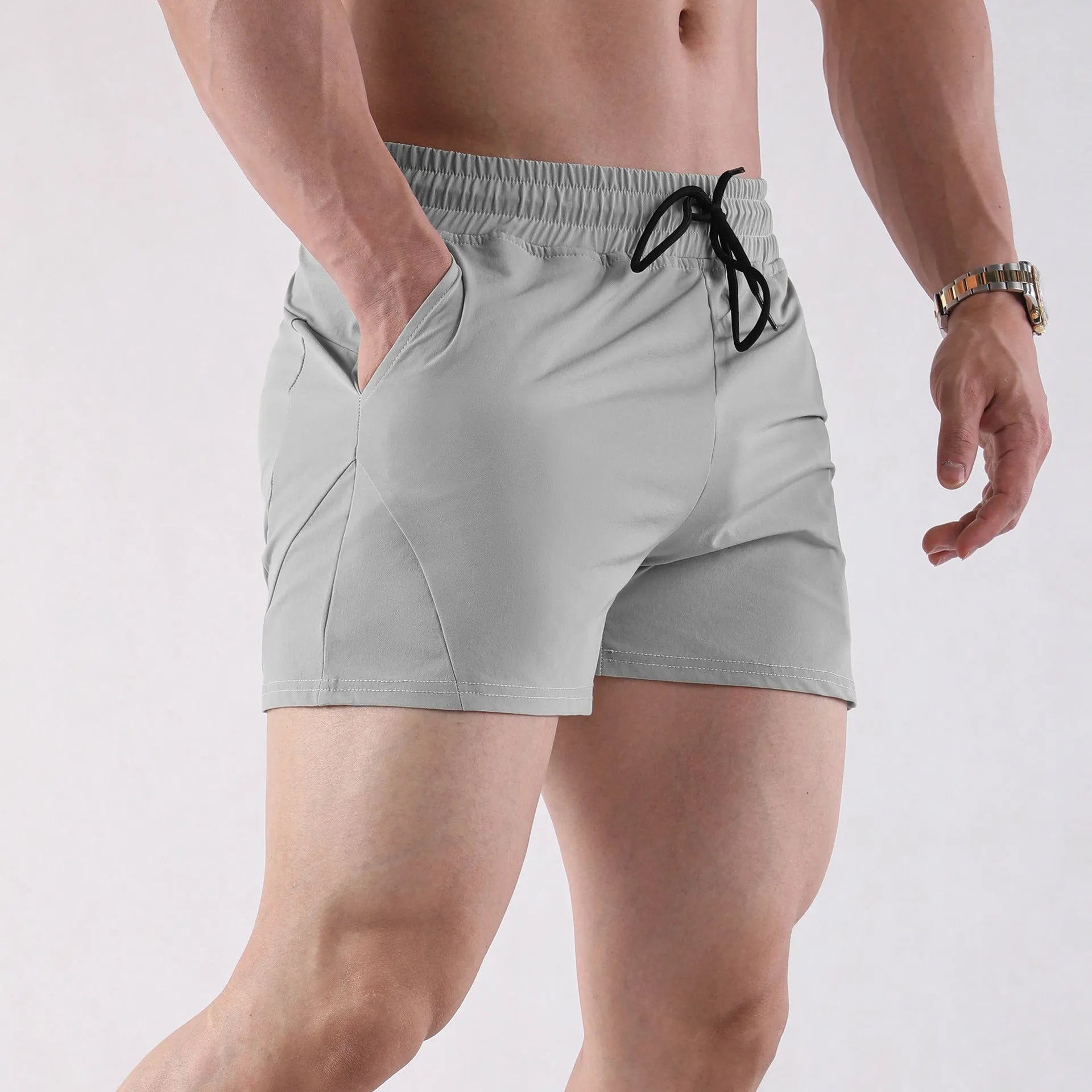 Men's grey polyester basketball shorts with elastic waistband shown front and back