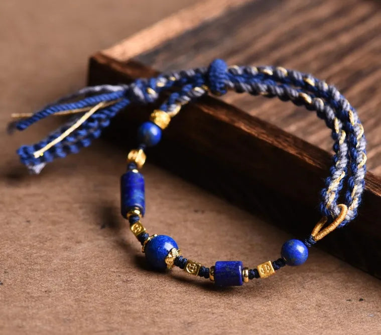 Hand-woven ethnic watch bracelet in flexible wire, showing Hongfei Ebony and Lapis Lazuli colour options.