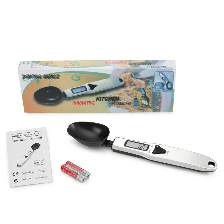 Smart digital kitchen measuring spoon with LCD display showing weight measurement.