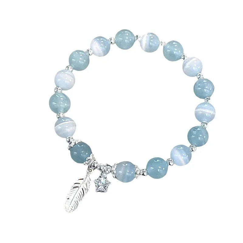 Korean style crystal bracelet with feather XINGX blue moonlight colour and eight Awn star design