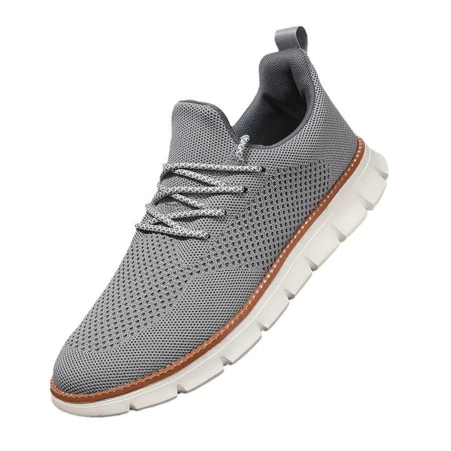 Men's grey mesh casual sneakers with round toe and low-cut design on a white background.