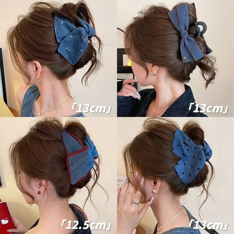 Close-up of a handmade hair clip with a denim bow and clear triangle acrylic grip.