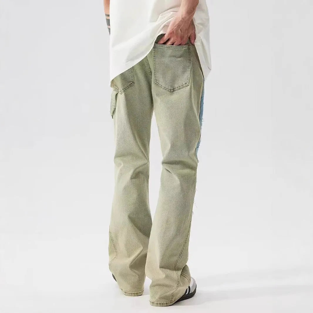 Yellow and blue retro patchwork jeans with splash-ink damaged design details on denim fabric