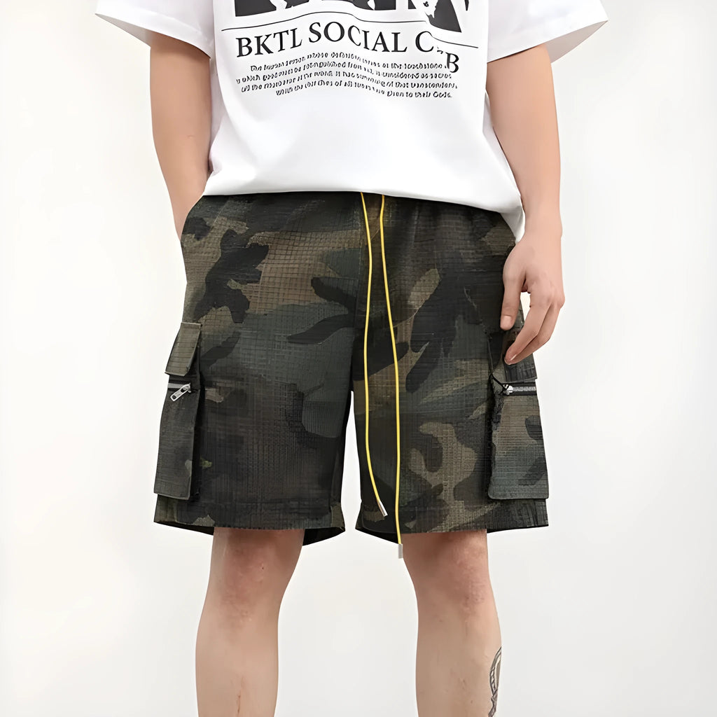 Men's camouflage cargo shorts showing multiple pockets and cropped leg length