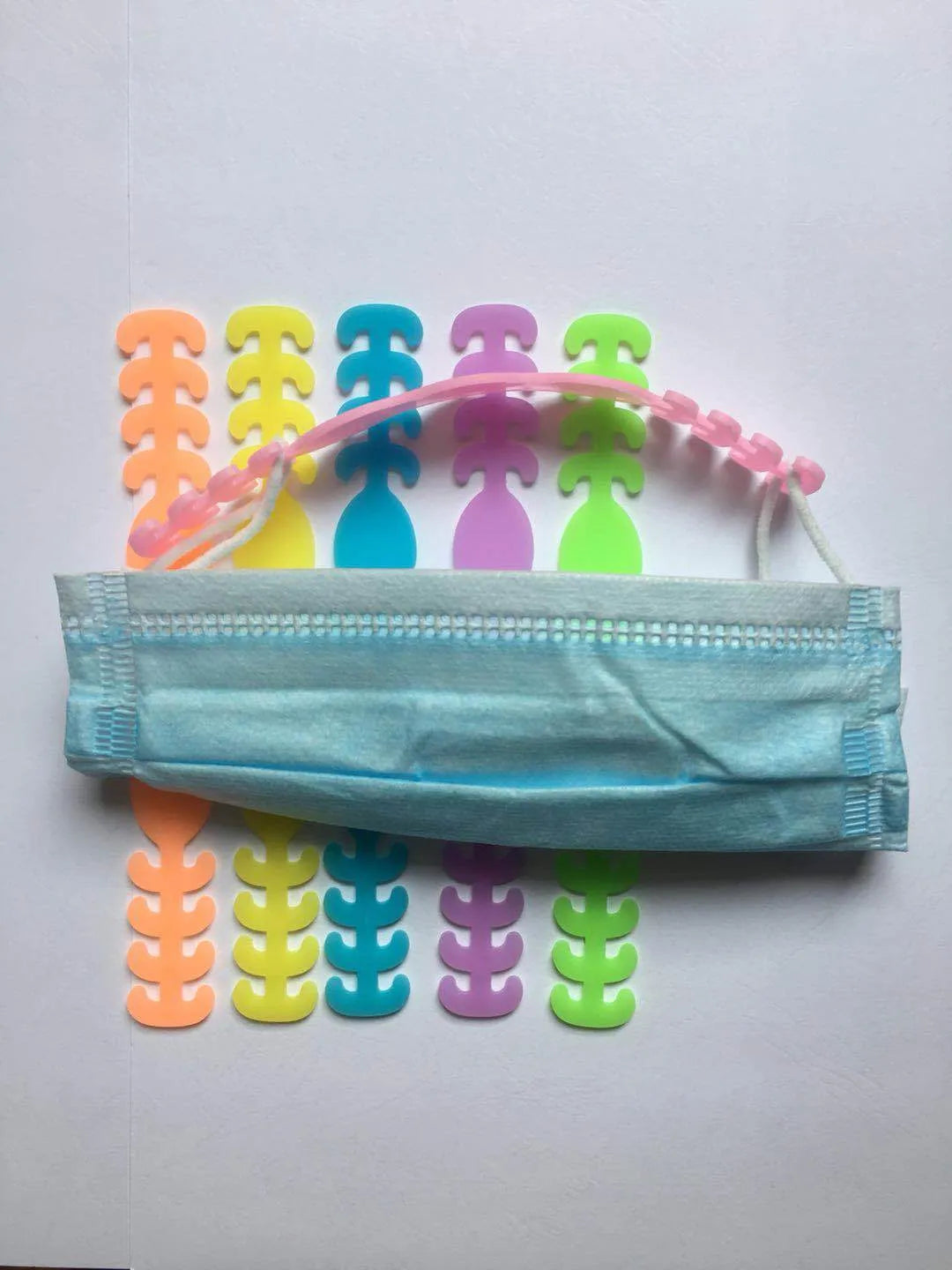 Pack of eight silicone protective tool buckles in assorted colours for cable and tool organisation.