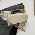 Creative Personality PU paper clip shoulder handbag in a horizontal square shape.