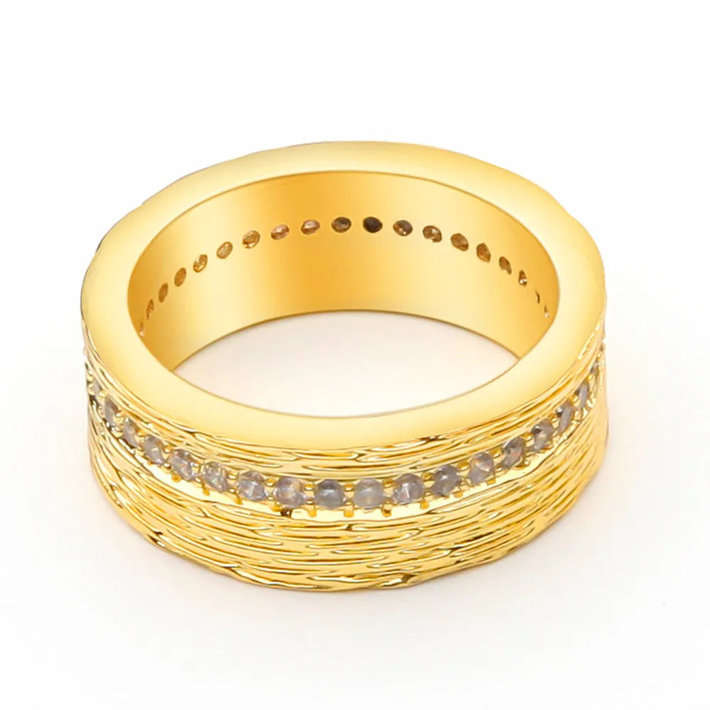Gold geometric women's zircon ring on a copper base, shown in size 7.