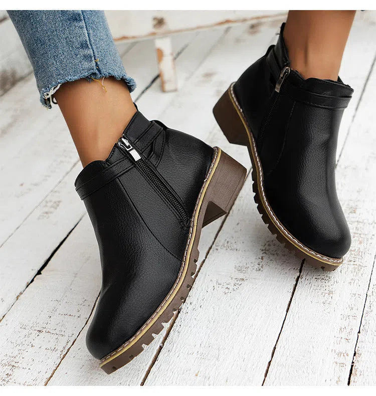Low-heeled leather belt-buckle plus-size round-toe ankle boots in black with side zipper and chunky heel