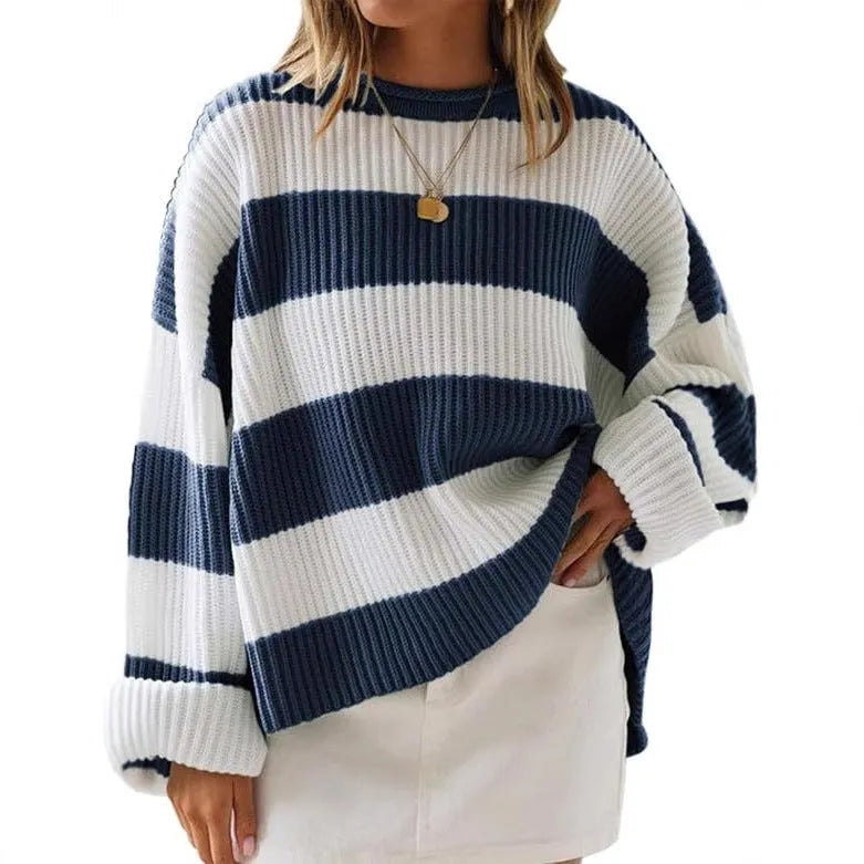 Women's striped loose sweater with bell sleeves and crocheted flower decoration.
