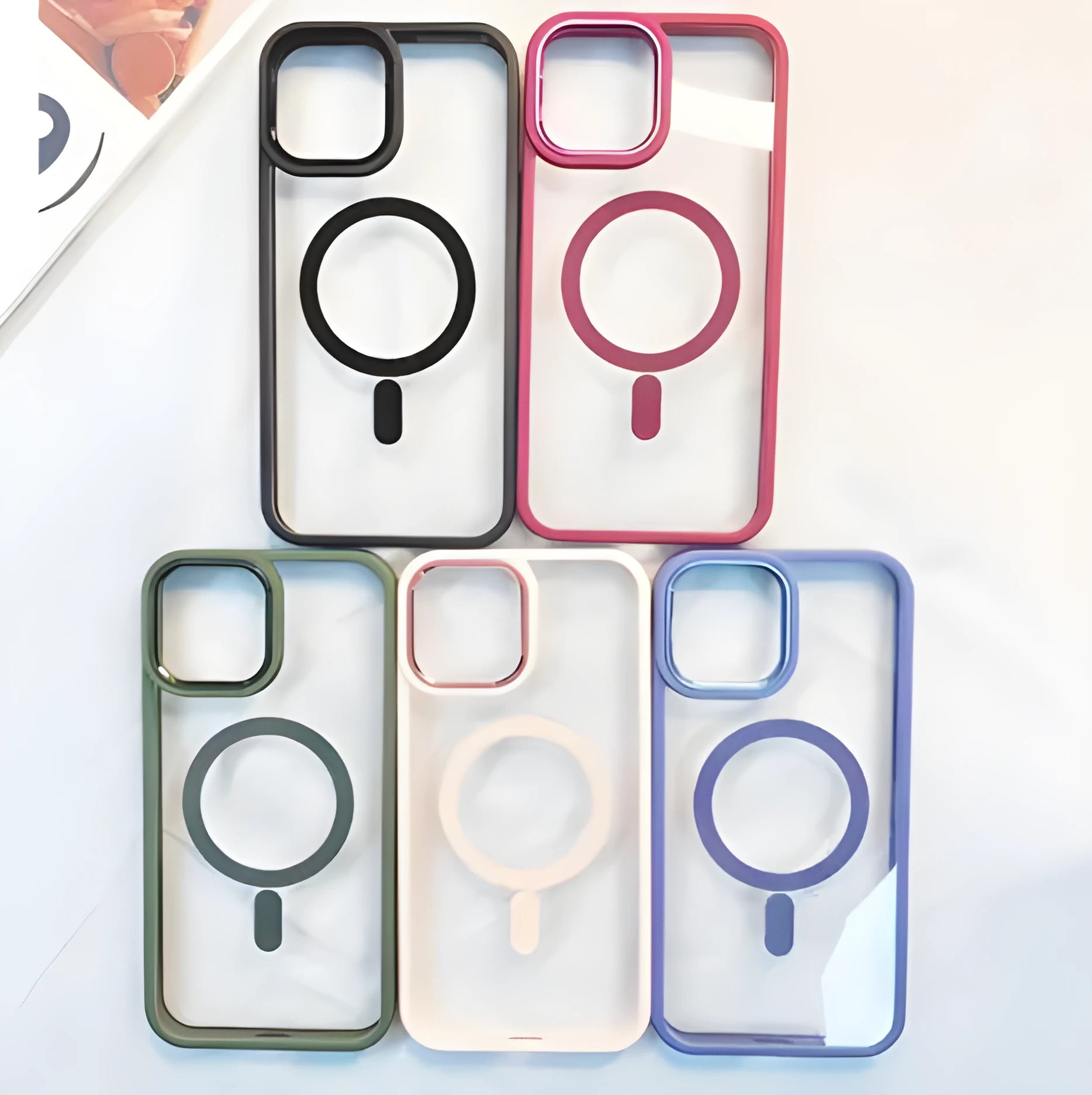 Silicone magnetic phone case for iPhone 15 Pro Max in black, showing transparent back and MagSafe ring