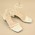 Beige women's square-toe sandals with a stiletto chunky heel and ankle buckle.