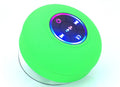 BTS07 waterproof Bluetooth speaker with suction cup mounted on car dashboard showing six colour options