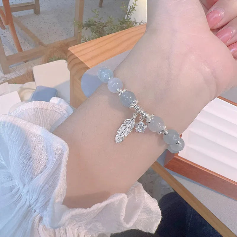 Korean style crystal bracelet with feather XINGX blue moonlight colour and eight Awn star design