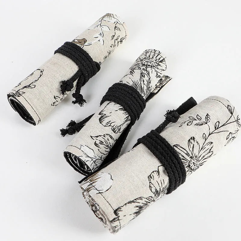 Black Peony printed canvas pencil roll bag unrolled showing 24 holes or 72 holes.