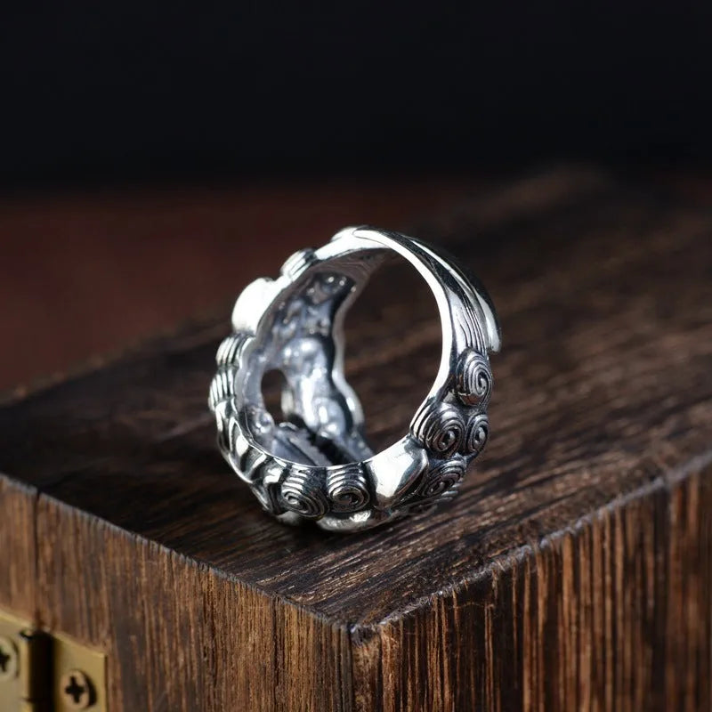 Silver open ring with a jibeast pattern, animal zodiac modelling, and a personalised diamond element.