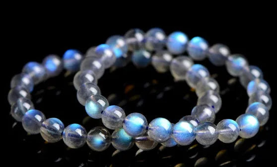 Natural cream body blue moonlight crystal bracelet with grinding finished beads on wrist