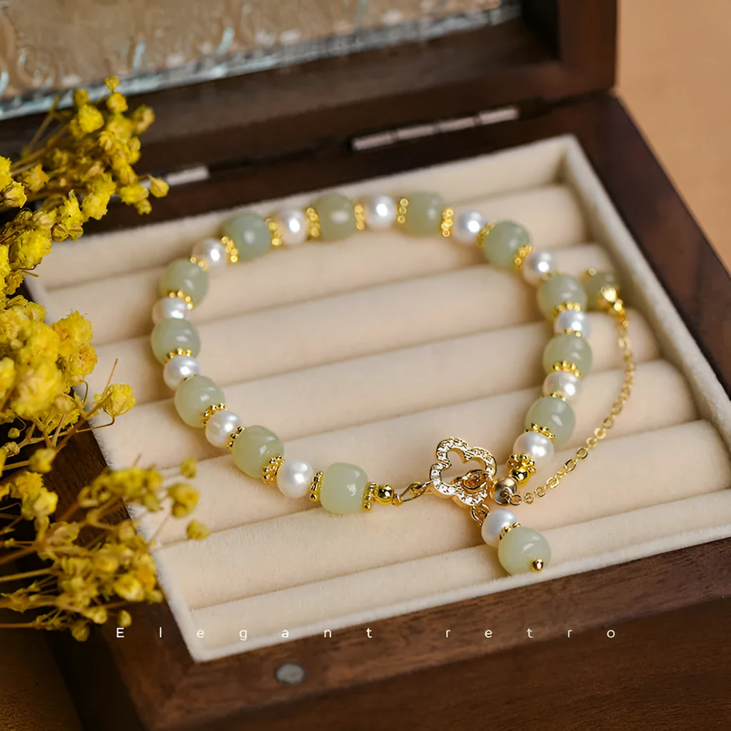 Hetian jade bracelet with gold electroplated alloy clasp and round pearl pendant