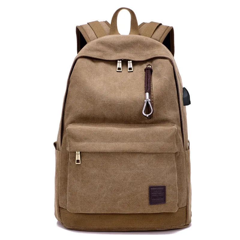 Canvas backpack in grey colour showing external USB port and multiple compartments.