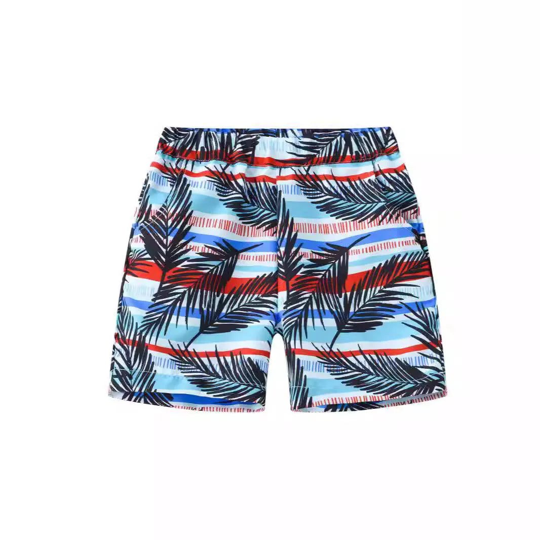 Colourful printed beach shorts with elasticated waistband showing coconut tree design