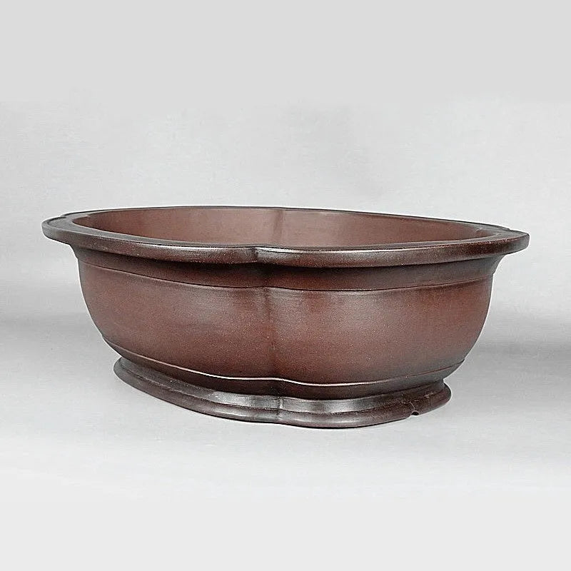 Handmade antique purple clay flowerpot in a crabapple shape, 74cm long.