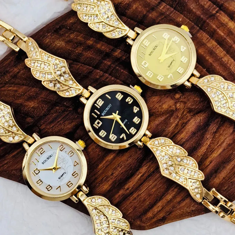 Women's stainless steel watch with round dial showing gold surface and vachette clasp