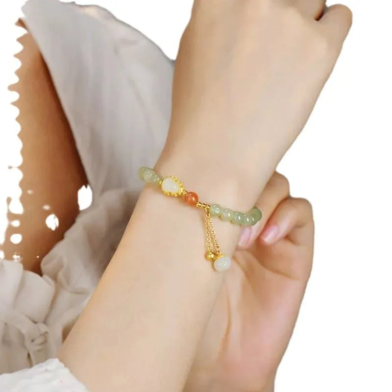 Qingshui jade women's bracelet with gold-plated gourd charm and fu character