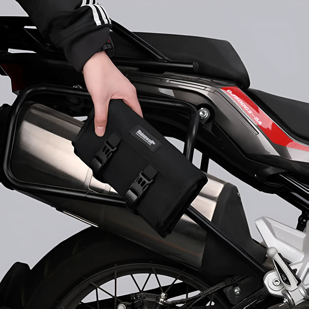 Motorcycle tool storage roll unfolded showing 8 elastic straps and mesh zipper pouch in black polyester fabric
