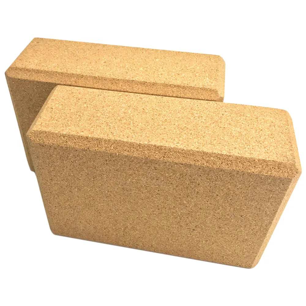 Yellow cork yoga brick with beveled edges and nonslip surface, size 24x16x8.5cm, on a plain background
