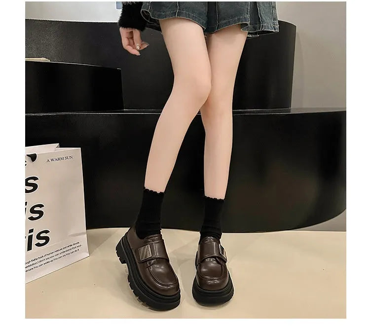 Women's chunky heel square toe shoes in black with cross strap and low top design